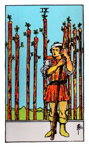 Nine of Wands meaning for upright and reversed positions using the Rider-Waite tarot deck.