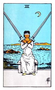 Two of Swords meaning for upright and reversed positions using the Rider-Waite tarot deck.